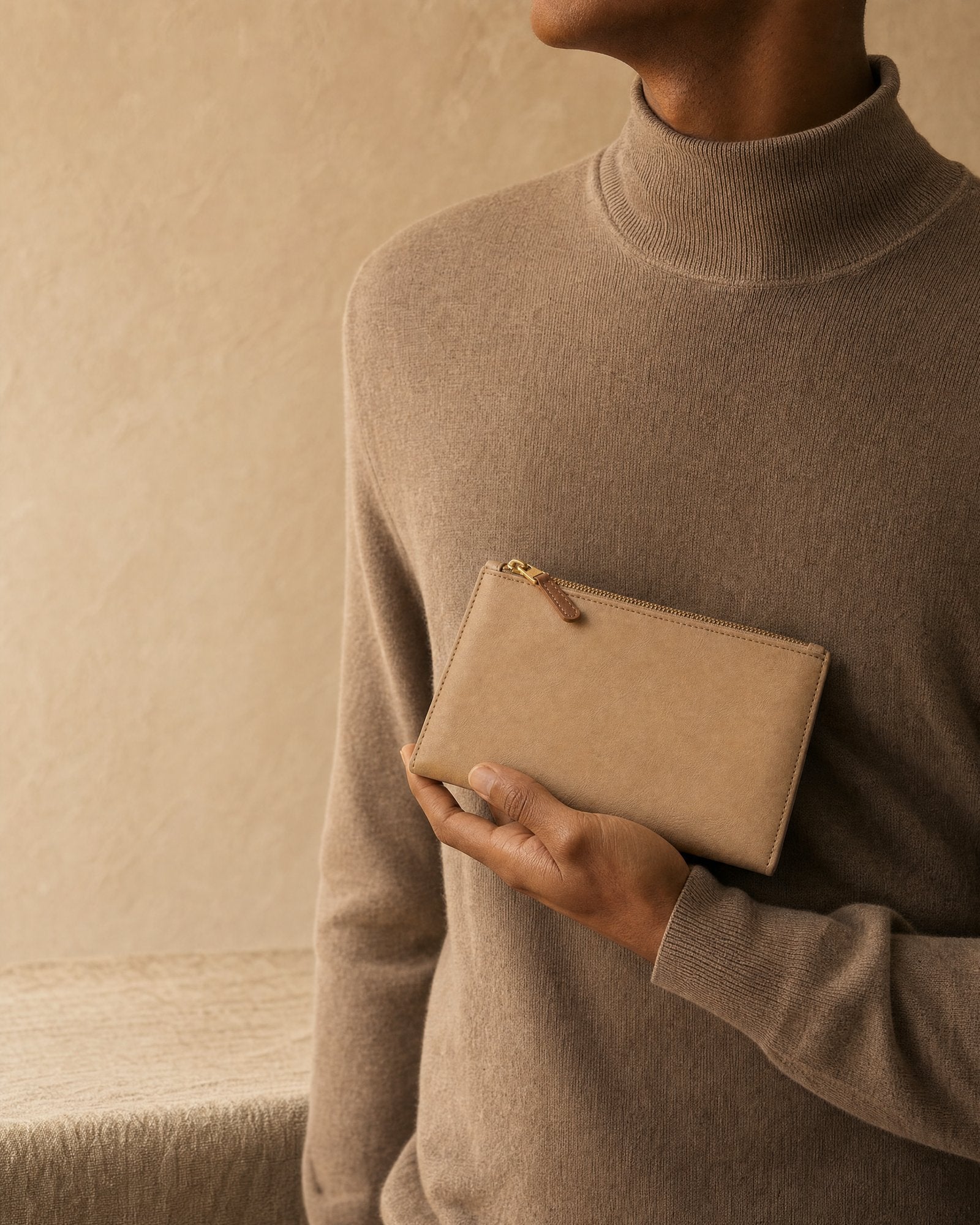 A pouch, in hand.